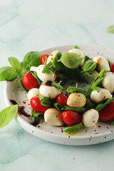 A plate with Italian salad caprese canape	