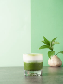 Glass of matcha latte with foam