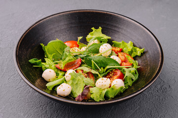 Caprese salad with tomato, mozzarella and basil