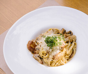 Delicious pasta with mushrooms and cheese in bowl