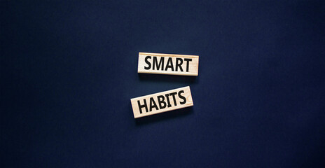 Smart habits symbol. Concept words Smart habits on wooden blocks. Beautiful black table black background. Business and smart habits concept. Copy space.