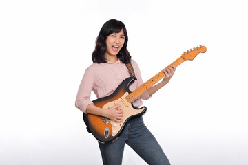 Asian woman playing a vintage sunburst electric guitar isolated on white background