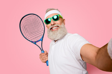 Competetive emotional cool grandpa with humor grimace exercising holding equipment, shoting photo. Body care, healthcare, weight loss, game, coach, champion, funky lifestyle