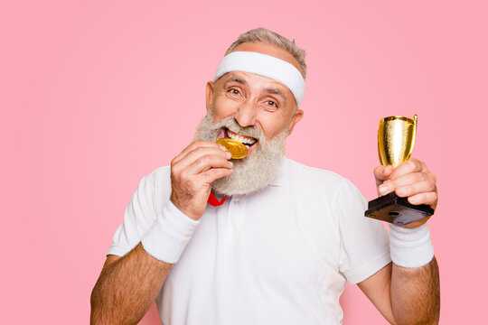 Active Emotional Cool Grandpa Holding Reward, Eating The Metal Sign Of Respect. Body, Health, Care, Lifestyle, Game, Coach, Challenge, Champ, Fit, Hero, Leisure, Training, Workout, Strength, Power