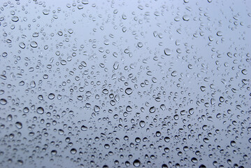 Raindrop window. Water droplets on a window. Rainy days.