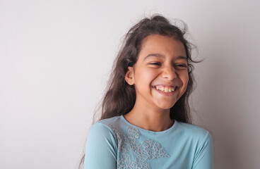 portrait of  a smiling little girl - 569223386