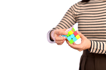 female hands holding a rubik cube standing on white background