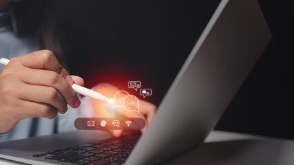 chat and recieve email, customer support hotline Contact us people connection. Businessman using computer keyboard with the email, call phone, address, Chat message icons.