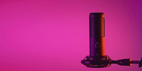 Studio condenser microphone isolated on dark background. Space for text.