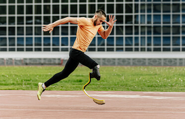 disabled athlete on prosthesis running at stadium