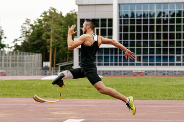 male paraathlete run-up long jump