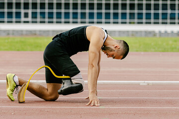 disabled athlete start on stadium track