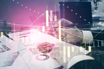 Close up of young business man and digital number of stock market background to represent...