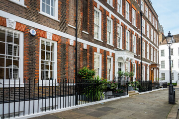 Fototapeta na wymiar Old beautiful houses in the city of Westminster, London