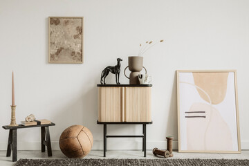 Modern composition of creative living room interior with elegant wooden cupboard, mock up paintings...