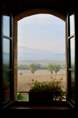View from an open window of the Tuscan countryside and autumn hills. Tuscany, Italy. 