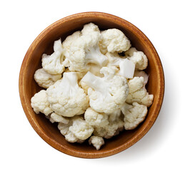 Cauliflower in a wooden plate on a white background. Top view