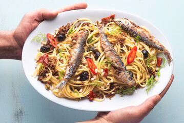 Pasta with sardines,  typical dish of the Sicilian culinary tradition, poor kitchen recipe, white...