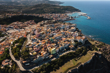 Fototapeta premium View of Castelsardo town from above, Sardinia, Sassari, Italy. Beautiful cityscape of Castelsardo in Sardinia shot with a drone. Castelsardo is famous travel destination of Sardinia, Italy.