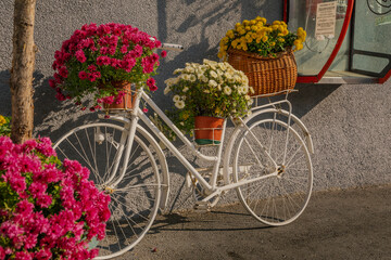 Fototapeta na wymiar Belgrade, Serbia. November 9th, 2022. Bicycle decorated with flowers in the Bajloni Market in Dorćol, Belgrade.
