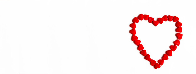 Banner of red hearts forms a heart shape on a white background. Isolated heart shape. The concept of love and romance. Romantic background composition. Valentine's Day