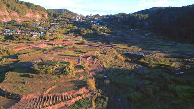 Cinematic aerial top view of Mountains, Fields and Rice Paddies