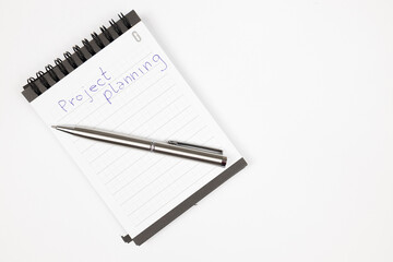 Project plan notes with metal pen - Productivity plan - Business and self improvement