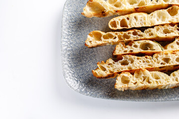 Bread and tomato served on plate 
