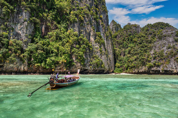 Naklejka na ściany i meble Tropical islands view with long tail boat ocean blue sea water at Pileh Lagoon of Phi Phi Islands, Krabi Thailand nature landscape