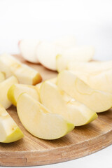 Sliced apple served on the wooden board