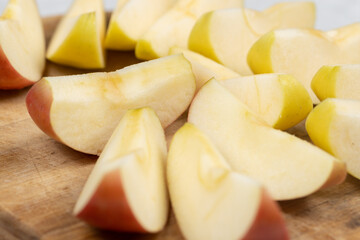 Sliced apple served on the wooden board