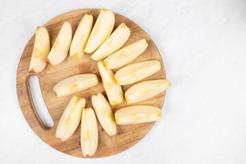 Sliced apple served on the wooden board