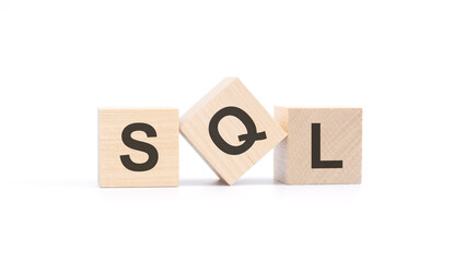 SQL - wooden blocks with letters, top view on white background
