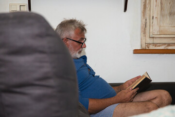 senior person reading a book