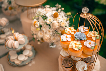 Tea party At The Garden, Beautiful English Afternoon Breakfast Ceremony with Desserts and Snacks, desserts various set, Placed in a cute white dish and the flower petals around. Relax and happy