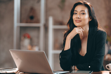 Portrait of young confident smiling Asian business woman leader, successful entrepreneur, elegant professional company executive ceo manager, working in co-working space business office