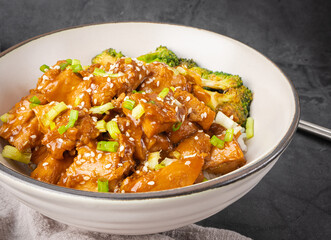 Delicious sweet chopping chicken rice, sesame seeds, sliced spring onions, broccoli, and vegetables and Chopsticks . Asian food, Japanese food. Top view.