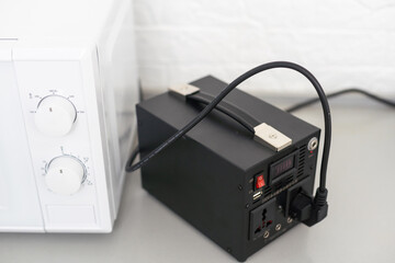 Obraz premium portable power station and microwave oven