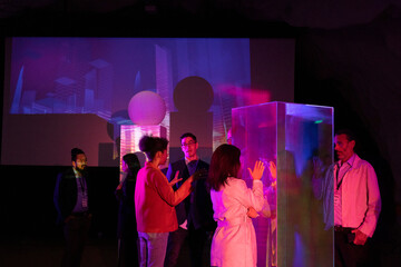 Female and male entrepreneurs discussing in seminar during corporate event