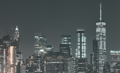 Manhattan skyline at night, color toned panorama, New York City, USA.