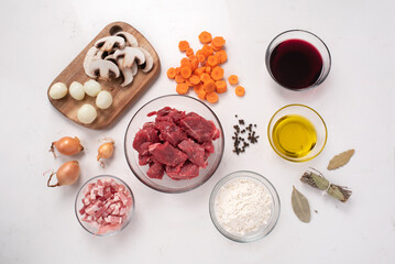 Beef bourguignon, recipe. Beef, mushrooms, red wine, onion, olive oil, carrots, herbs. Ready to be cooked.