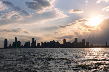 Beautiful Sunset over the Hudson River with the Silhouette of the Jersey City New Jersey Skyline