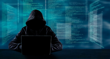 Hacking and technology crime concept. No face hacker with laptop with code background.