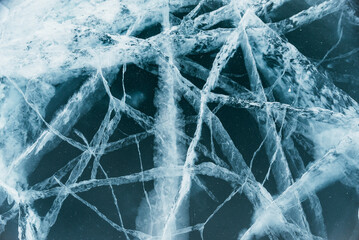 The beautiful Baikal ice with magical cracks before your eyes. This is really cool. The camera moves down the ice. Extreme close-up view.