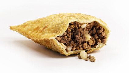 Brazilian pastry, typical fried salty stuffed with ground beef, sauce and pepper, typical brazilian salt, served in bakeries, bars and restaurants, isolated white background, copy space