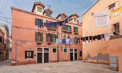 View of old traditional Venetian houses along the canal.