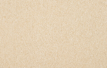 Fototapeta na wymiar Yellow sand in a random arrangement of grains.