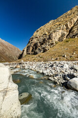 Mountain river in the Bezengi Gorge. Nature of Russia Caucasus. Mountain landscape.