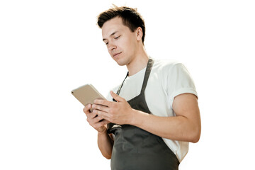The guy is an employee in uniform using a tablet online plan, isolated transparent, PNG background.	

