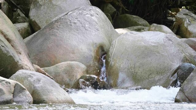 Close Up of Water Flowing Through Rocks in the Pristine Nus River